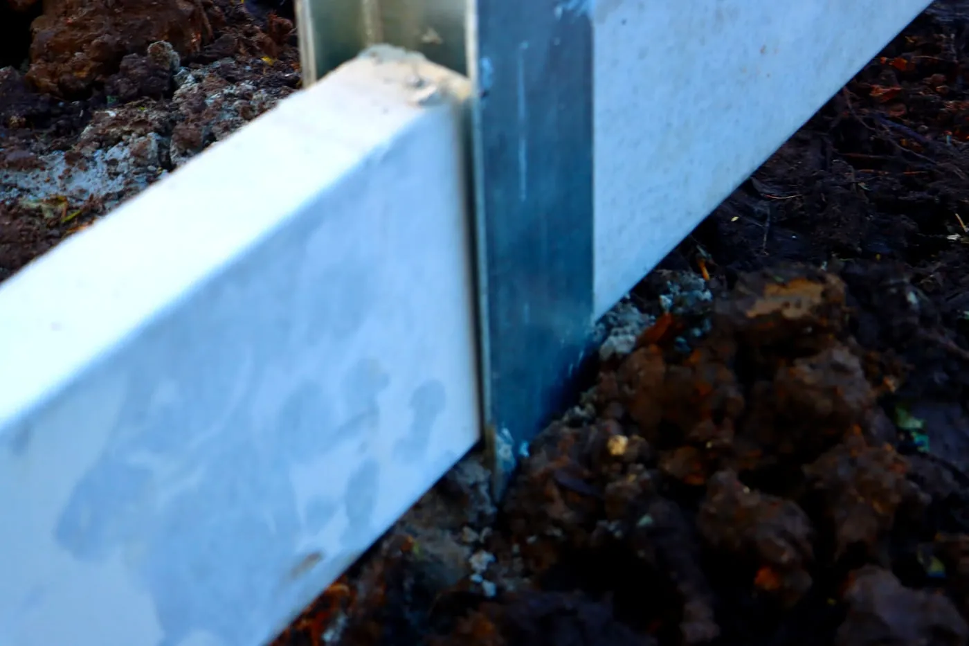 Concrete sleeper face and galvanised post detail by Adams Earthworx